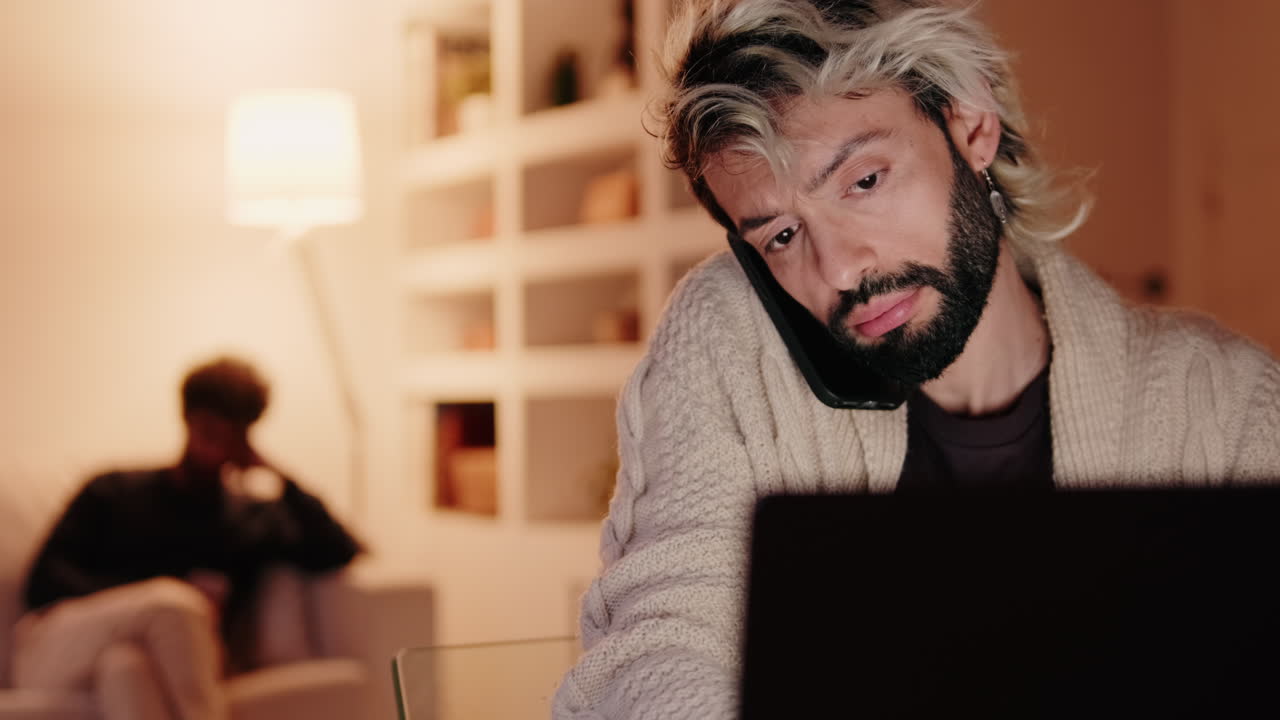 Gay Couple at Home: Working Late