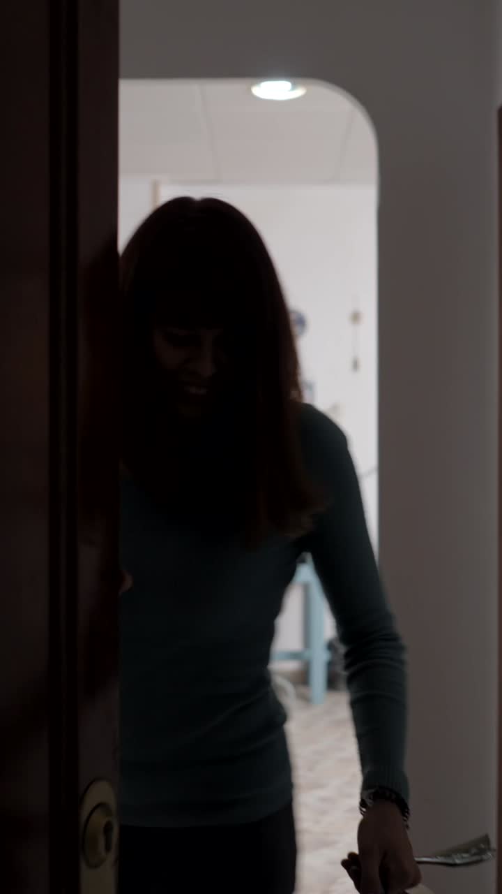 Woman Entering and Viewing a Workshop