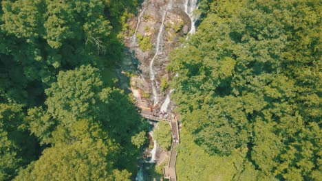 epic drone footage of people walking at the base of amicalola falls, the largest waterfall in all of georgia