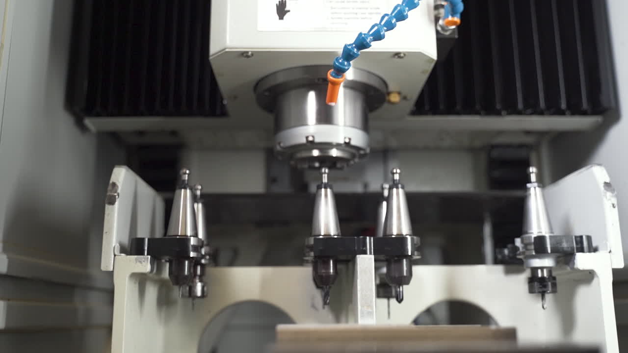 CNC machine detaching an ejectable drill, putting it into a tool rack