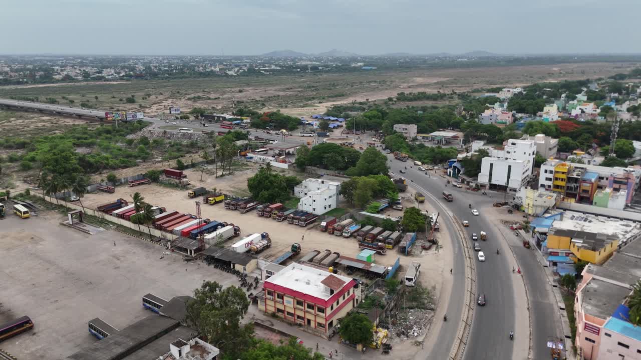 Aerial footage of the highway passing through a large industrial zone