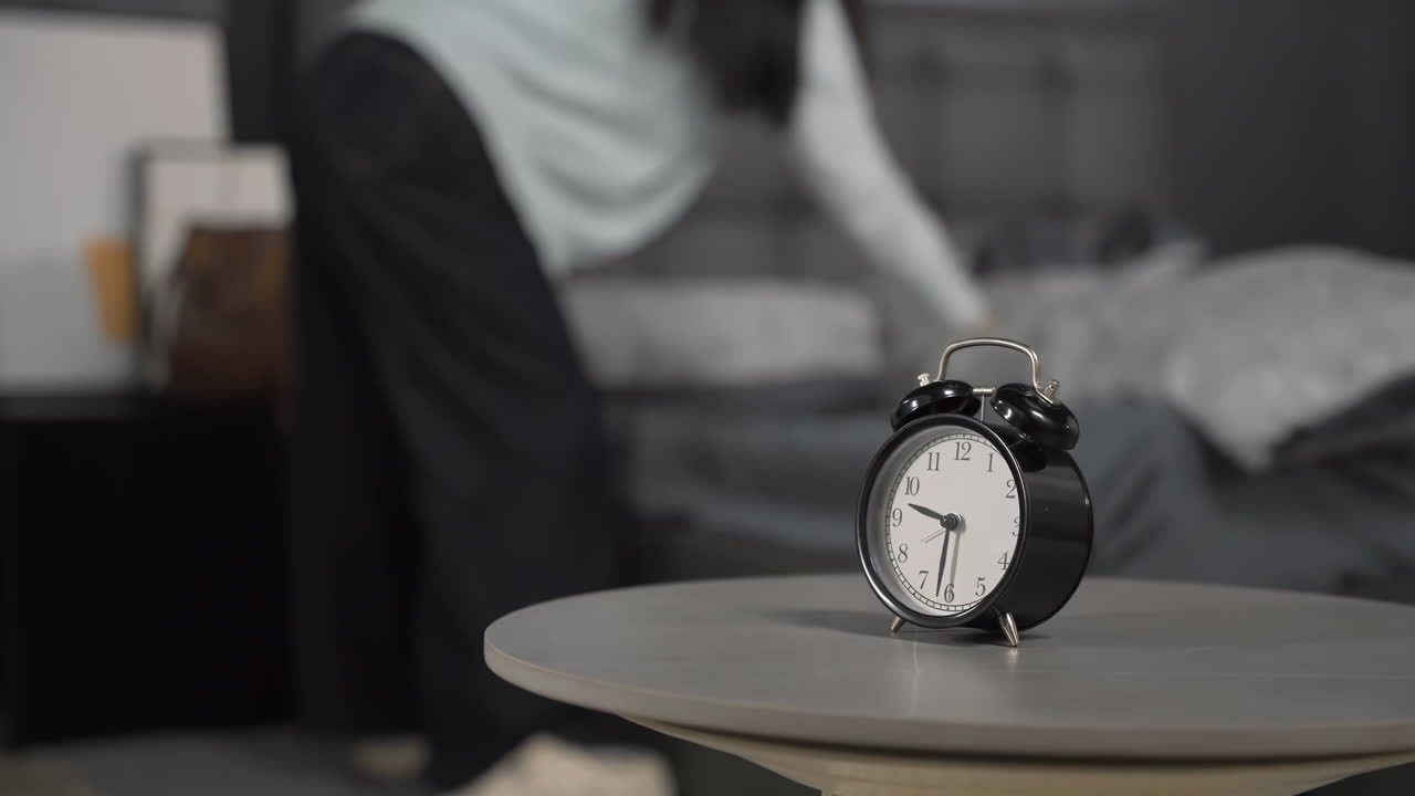 Morning of hurrying overslept young woman waking up to missed alarm near bed, getting late work, morning stress, getting out of bed in a hurry running late for work, appointment or class study