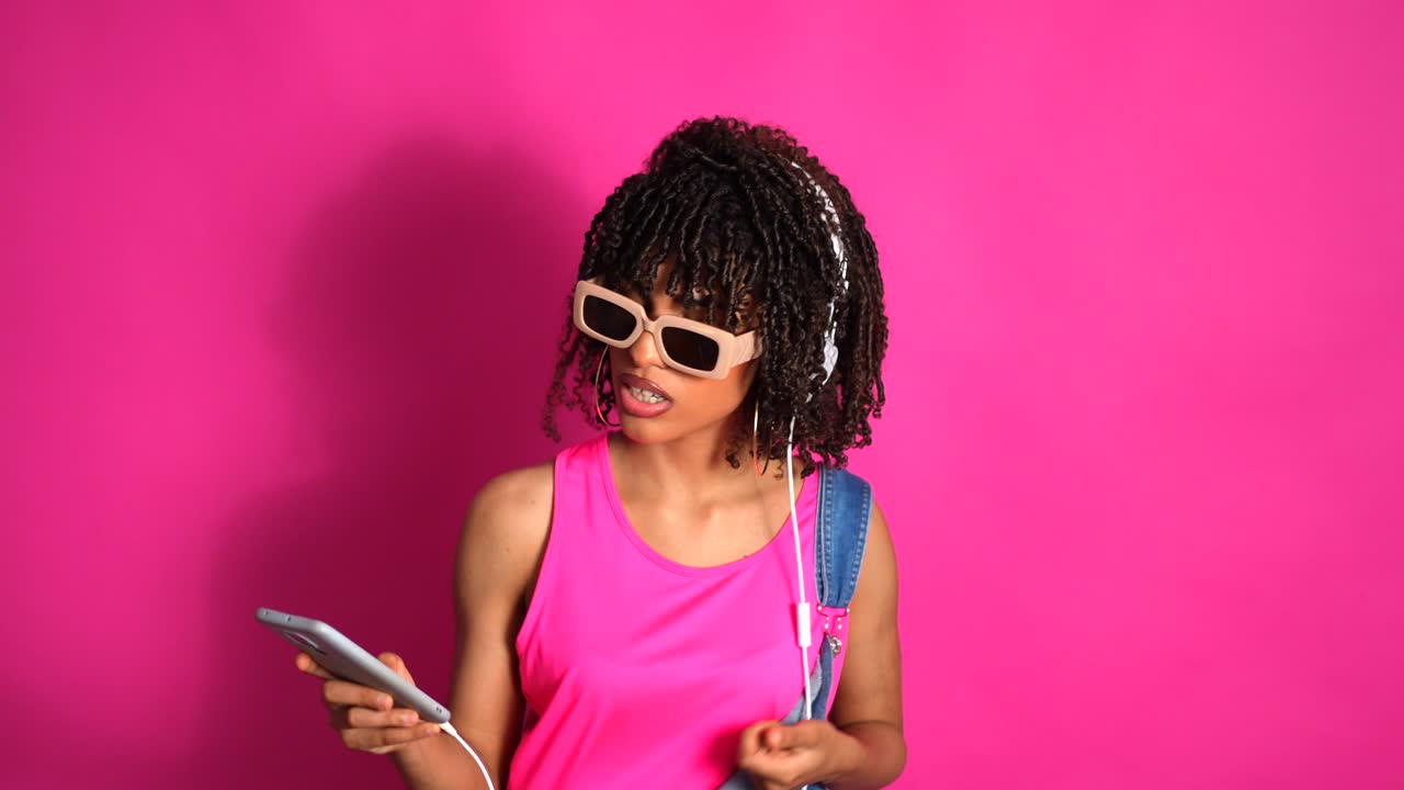 Woman listening to music with headphones and smartphone