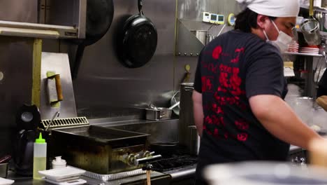 chefs working together in a busy kitchen