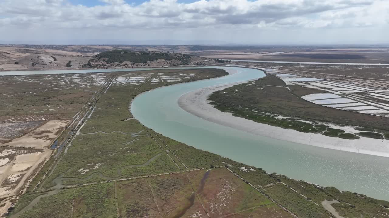 Cinematic shot of the ancient Lixus site overlooking the Loukkos River, capturing historic ruins, textures, and natural landscape in smooth professional motion