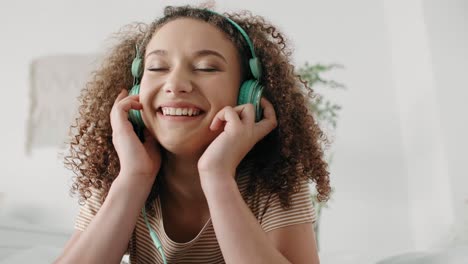 teenage girl listening to music and dancing