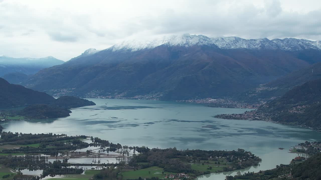 Aerial view of the Alps and Italian lake in early springtime
