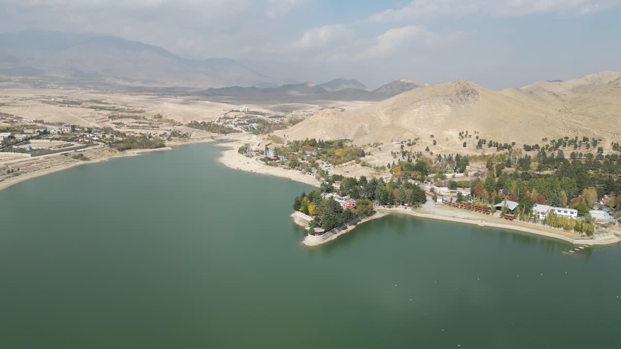 Qargha Water Reservoir, West of Kabul, Afghanistan. Drone Shot of Lake, Lakefront Buildings and Landscape