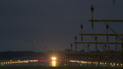 airplane landing and taking off at night