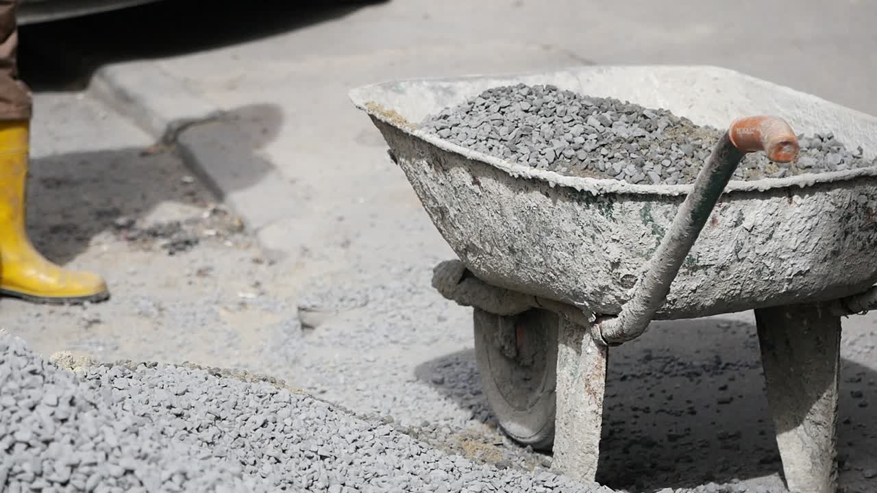 Construction Site with Wheelbarrow and Gravel