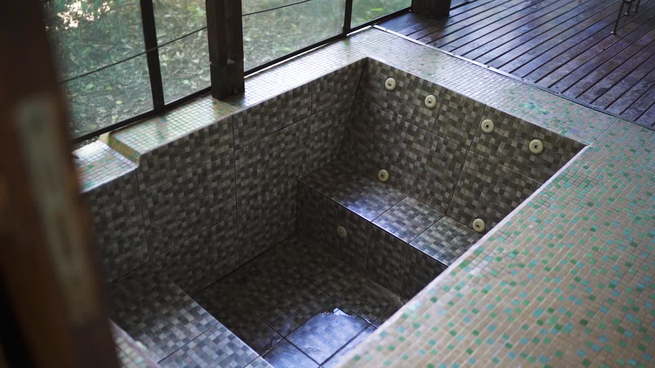 Empty Hot Tub on a Wooden Deck