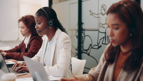 three businesswomen working in a call center