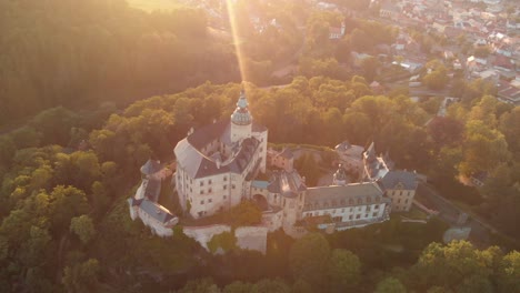 The-aerial-shot-of-the-magical-castle-in-Frydlant-in-Czech-Republic-during-sunset