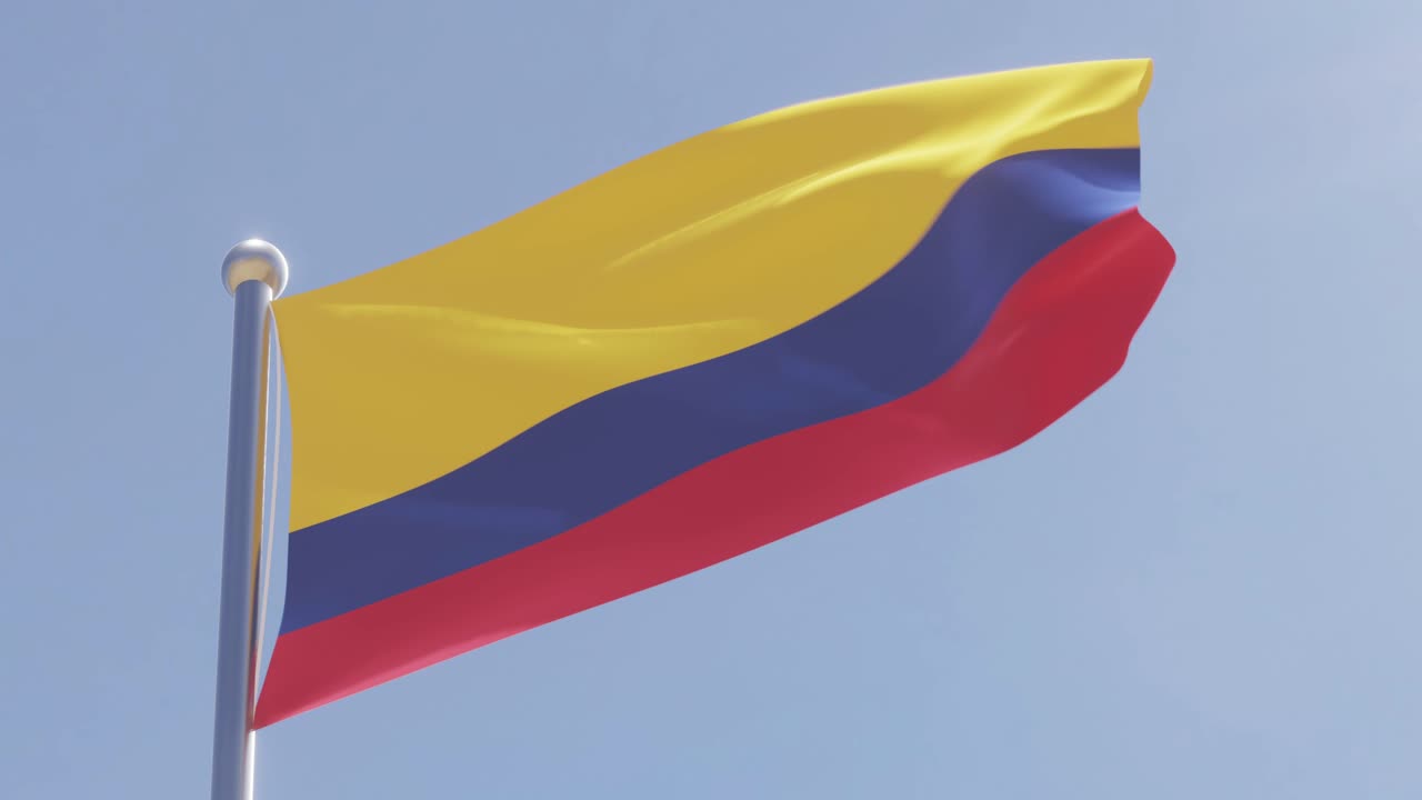 Bandeira da Colômbia tremulando em um dia de céu limpo