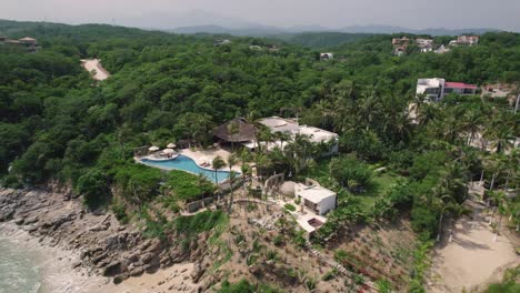 Aerial-over-picturesque-landscape-along-the-mesmerizing-coastline-in-Huatulco,-Mexico