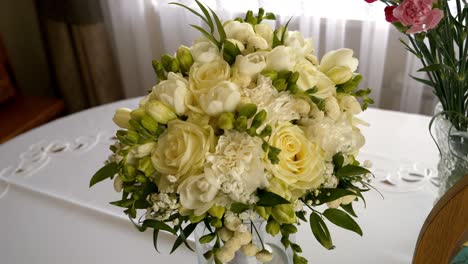 a beautiful bridal bouquet made of white and yellow roses