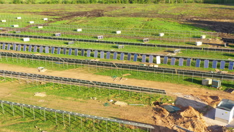 expansive solar panel installation in a green field in construction process