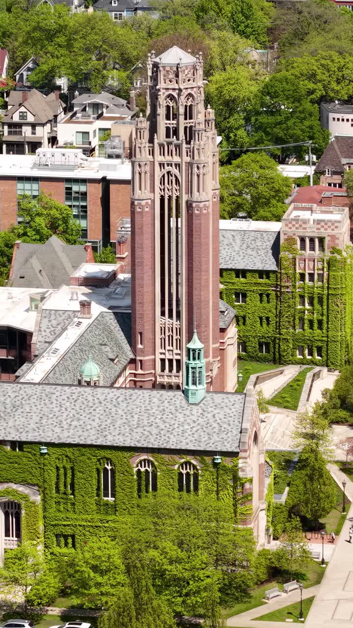 University of Chicago, Vertical Drone Shot of Saieh Hall For Economics Building With Climbing Plants and Tower, Illinois USA