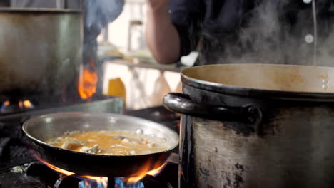 chef preparing seafood risotto in restaurant, close-up, mediterranean