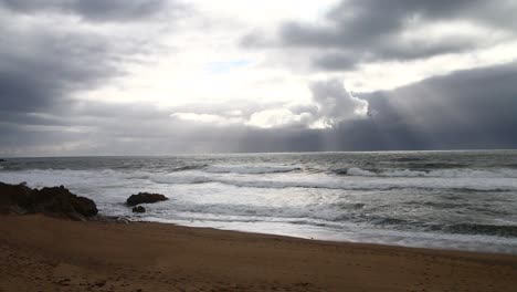 Waves-crushing-lighthouse-in-Porto-in-a-cold-cloudy-and-windy-evening