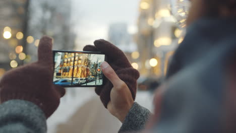 taking a picture of a cityscape in winter