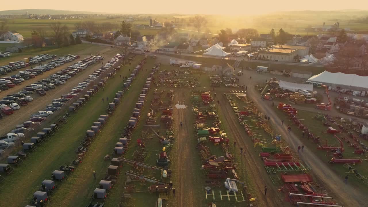 Aerial of an Early Morning View of Opening Day at an Amish Mud Sale Selling Farm Equipment to Quilts