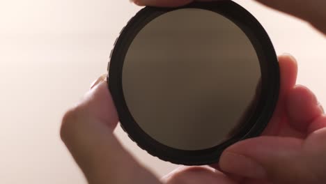 hand holding a neutral density filter