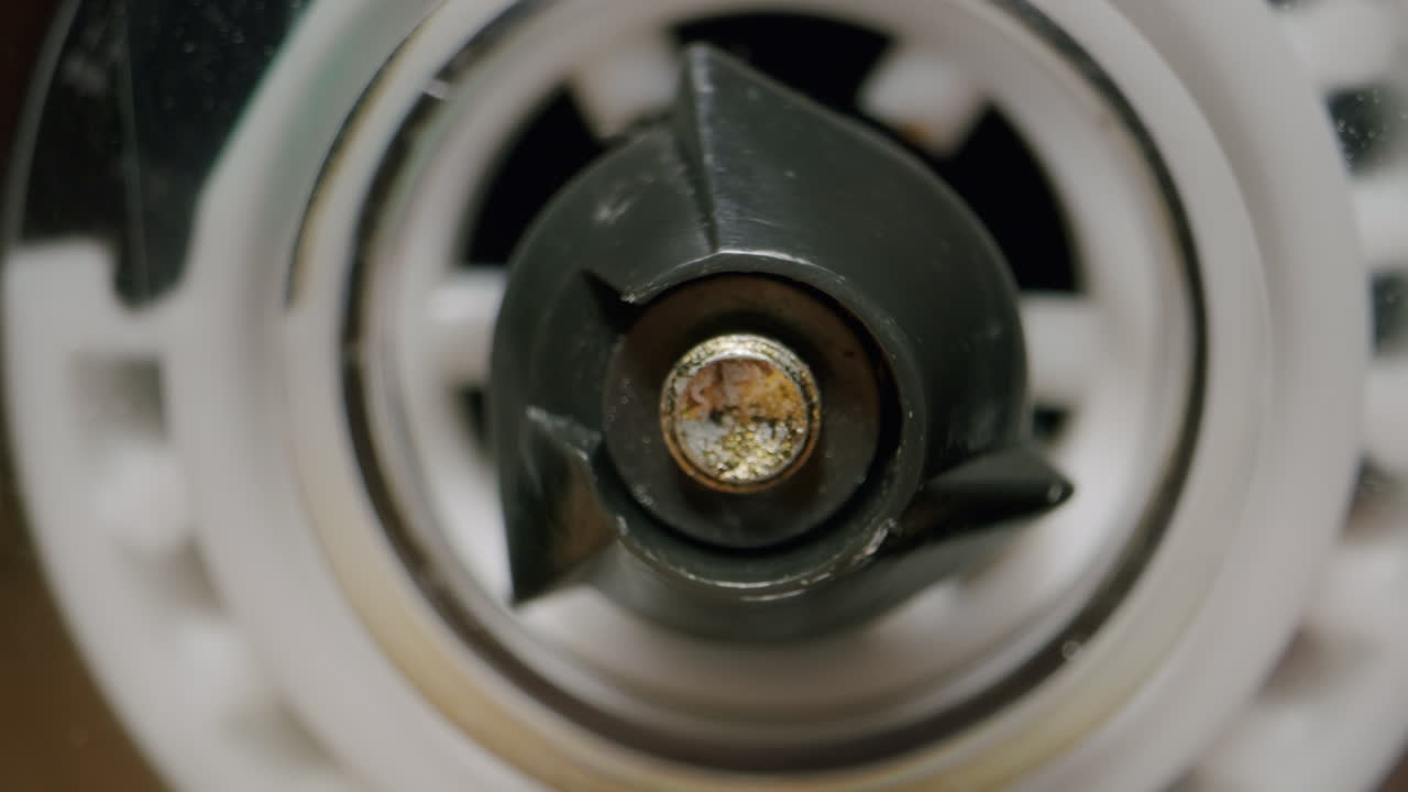 Close-up of a blender or food processor blade and motor component