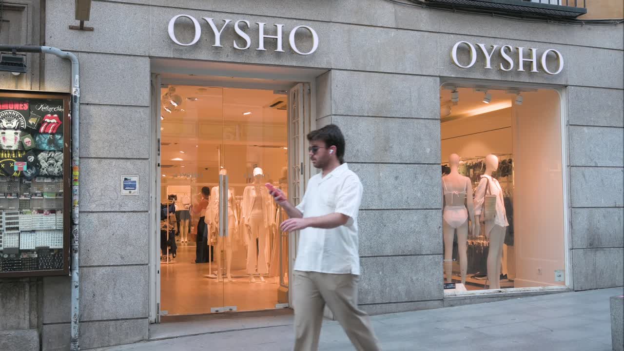 Pedestrians pass by the Oysho store, a Spanish retailer specializing in women's homewear and undergarments, owned by the Inditex group, near Plaza del Sol and the retail hub of Gran Vía in Spain