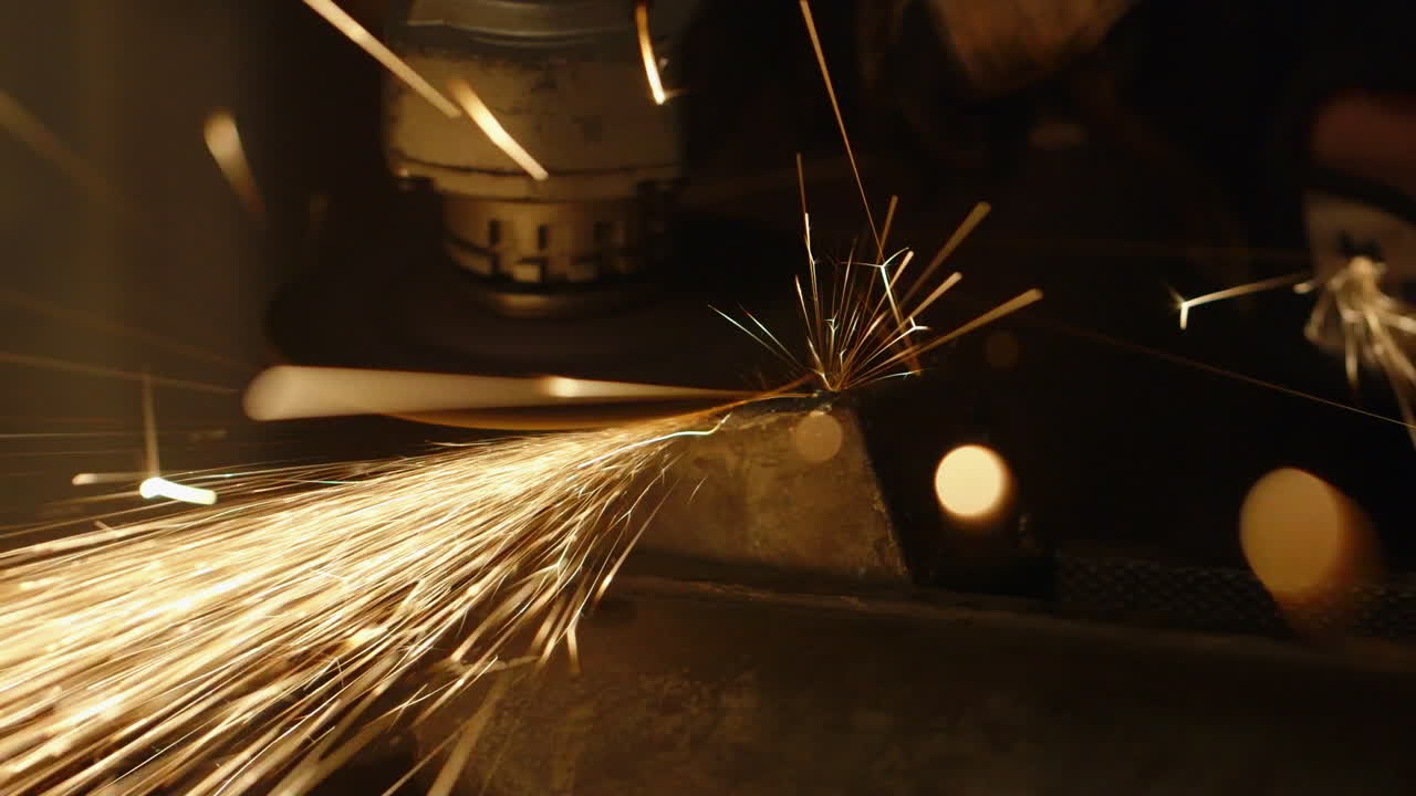Sparks fly from a grinding power tool