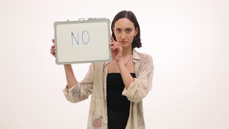 woman holding a 'no' sign