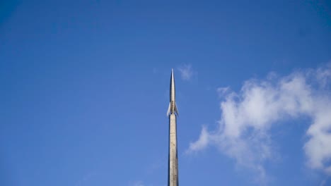 rocket monument against a blue sky