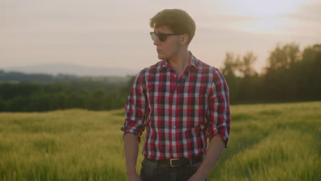 portrait of fashionable farmer against sunset