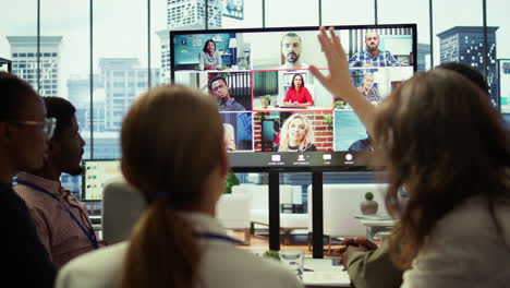 company employees attending a meeting via videocall with investors