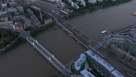 High-angle-view-of-trains-driving-on-multi-track-Grosvenor-Railway-Bridge.-Aerial-view-of-rail-traffic-across-Thames-river.-London,-UK