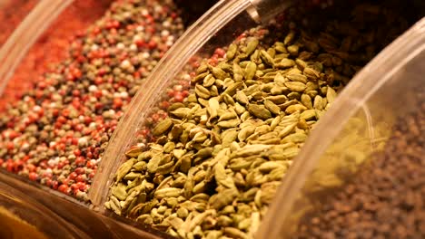 assortment of dried spices in display jars