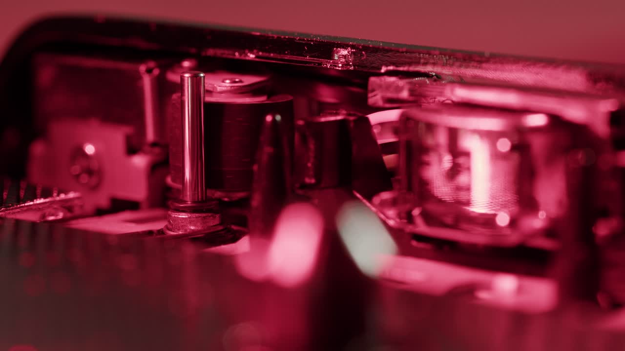 Vintage cassette player on a desk with headphones and tapes creates a nostalgic audio scene, evoking retro vibes