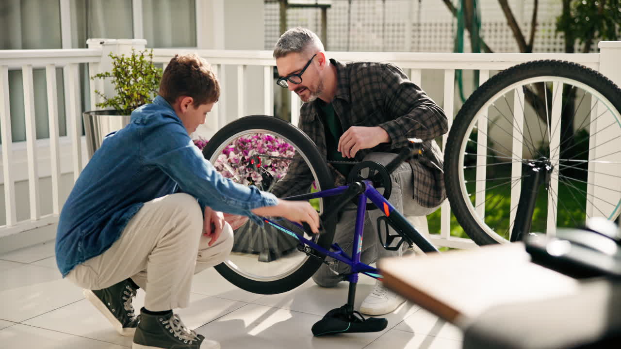 Father and Son Fixing a Bicycle Together