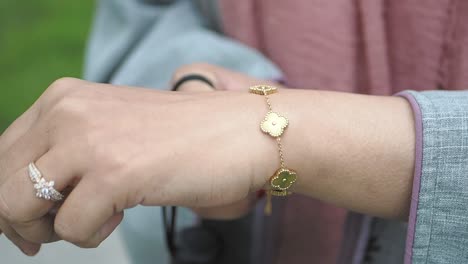 woman with a gold bracelet