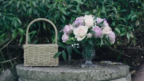 bridesmaid's flower and the baslket outdoor on the rock