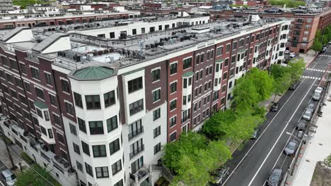 Upscale-renovated-brick-luxury-apartment-building-in-Hoboken-New-Jersey-with-Lower-Manhattan-skyline-in-distance