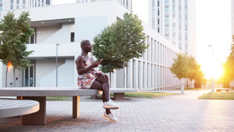 woman sitting on a bench in an urban setting