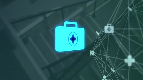 animation of network of medical icons and data processing over hospital