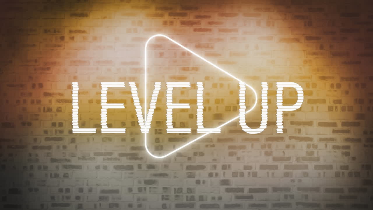 animación digital del texto de nivel superior sobre el icono de juego de neón contra la pared de ladrillo