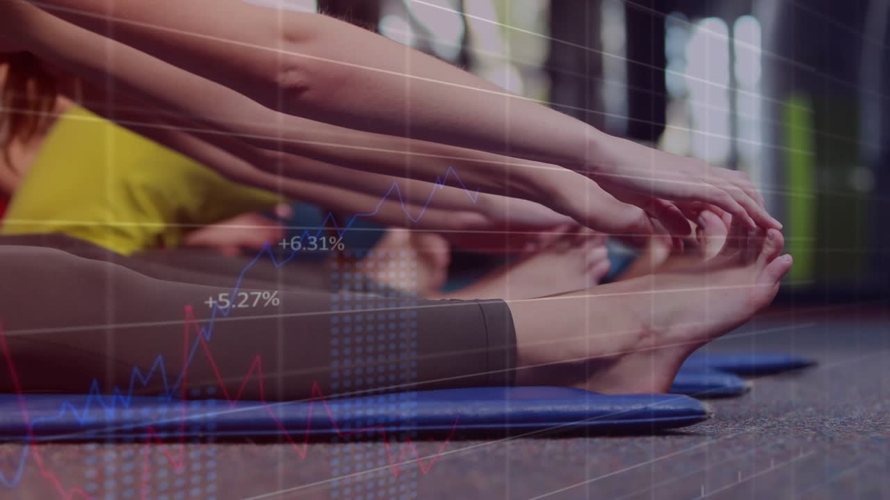 Fitness group on coach cue, reaching for toes on blue mats, charts overlaying legs showing range