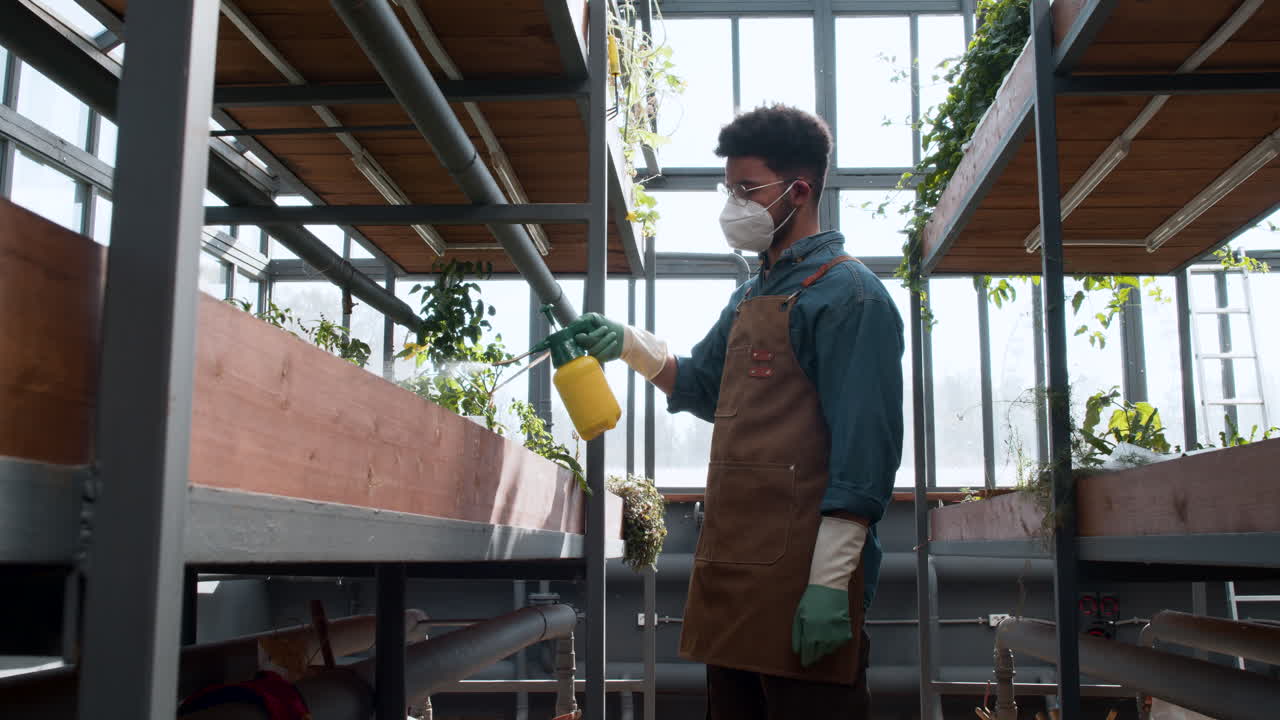 Male gardener working indoors
