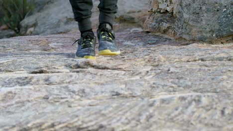 male hiker walking in rocky mountain 4k