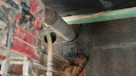 worker drills a wall with a powerful power tool makes holes for laying communications