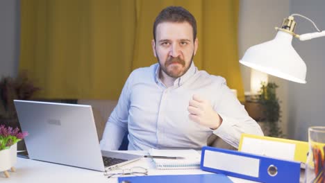 home office worker man looking nervously at camera.