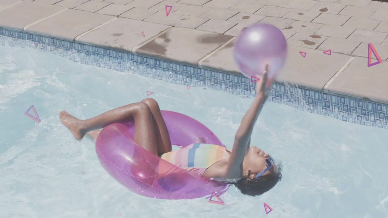 Vídeo vertical: Menina em bola de anel flutuando, alcançando e arremessando formas rosas que estouram, brincando para anúncios.